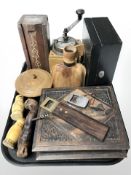 A coffee grinder, Russian dolls, rustic cork screws and bottle openers,