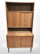 A mid-century teak sliding door cabinet, width 90 cm.