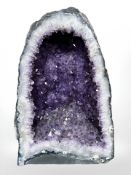 An amethyst geode, height 32 cm. CONDITION REPORT: 10.4kg.