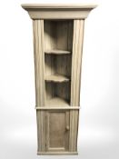 A stripped pine corner cabinet, width 72 cm.