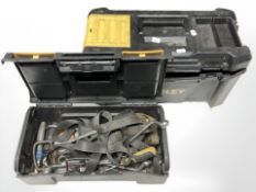 Two Stanley toolboxes, one with contents.