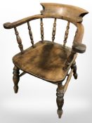 A 19th century elm elbow chair,