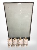Rectangular glass topped coffee table on foo dog supports, length 154 cm.