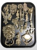 A collection of brass door knockers.