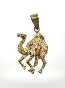 An eastern gold camel pendant, length 27mm. CONDITION REPORT: Apparently unmarked.