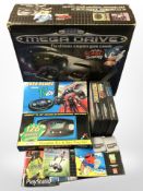 A Sega Megadrive 16-bit games console with original box, several games,