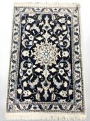 A Nain rug, 59 cm x 87 cm.