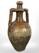 A treacle glazed twin handled vessel, height 47 cm.