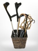 A wicker basket of walking sticks,
