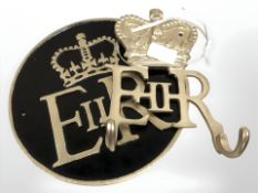 Two painted metal plaque E.R. II and matching coat hook.