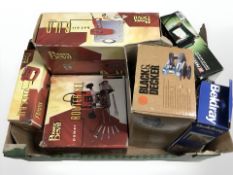 A group of boxed tools including Power Devil router, power jigsaw and hot air gun,