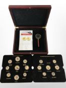 A collection of London Mint Elizabeth II decimal and pre-decimal enamelled coins in case with