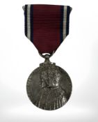 A silver George V Jubilee medal
