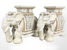 A pair of ceramic elephant plant stands, height 43 cm.