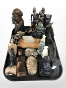 A group of African carved busts, carved hardstone scarab beetles, other hardstone carvings.