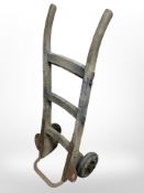 An early 20th century wooden sack barrow.