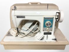 A New Home model 133 electric sewing machine with lead and pedal