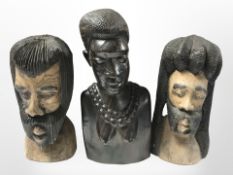 An African carved hardwood bust of a lady and another two busts of gentlemen, tallest 22 cm.