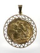 A George V full gold sovereign in 9ct gold pendant mount CONDITION REPORT: 10.