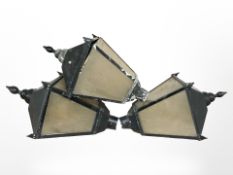 Three painted metal lanterns, height 95 cm.