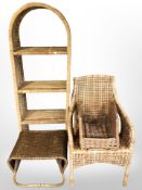 A four tier wicker bookshelf together with further wicker items