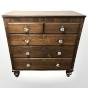 A 19th century oak five drawer chest with glass handles,