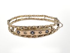 A Victorian 9ct rose gold sapphire and diamond bangle,