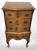 A reproduction mahogany low boy chest,