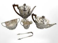 A silver four piece non matching tea service, together with pair of silver sugar tongs, London,