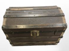 A vintage cane domed topped storage chest,
