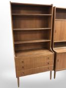 A mid-century teak bookcase, fitted with three drawers to base, width 89 cm.