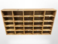 A mid-20th century alphabetical pidgeon hole shelving unit, 131 cm x 72 cm x 18 cm.