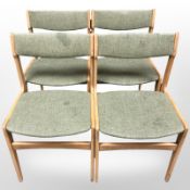 A set of four ply wood 20th century chairs in green fabric