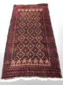 A Balouch rug, Afghanistan, 194 cm x 104 cm.