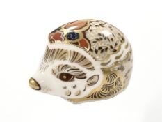 A Royal Crown Derby Bramble Hedgehog paperweight, with gold stopper,