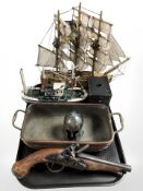 A replica flintlock pistol, twin handled copper vessel, miniature bronze Greek Hoplite helmet,