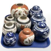 A group of Chinese blue and white porcelain ginger jars decorated with prunus,