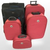A graduated set of Pro World luggage, together with a further black luggage case.