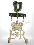 Two painted metal cup racks, Ireland and Elizabeth II.