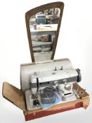 A Jones model 562 electric sewing machine with lead and pedal,