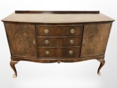 An early 20th century bow fronted sideboard,