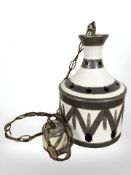 A 1970's glazed earthenware light shade, height 32 cm.