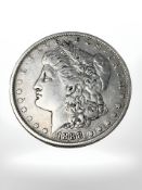 An 1888 USA silver dollar.