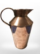 An Arts and Crafts copper jug with applied brass plaque 'H.
