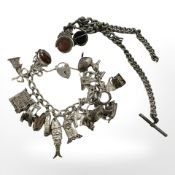 A silver charm bracelet and a plated Albert chain CONDITION REPORT: Charm bracelet