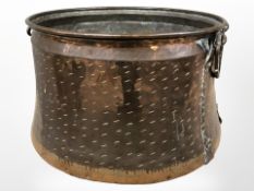 An antique copper twin-handled bucket,