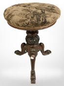 A Victorian rosewood revolving dressing table stool.