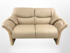 A continental cream leather two seater seater settee, width 159 cm.