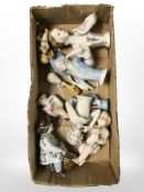 A group of china half dolls and further figures.