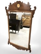 A Chippendale style bevelled mirror,